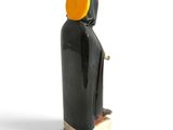 figurine of a man in a black robe with a yellow hat