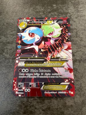 a close up of a pokemon card on a carpet