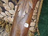 a close up of a cane with a sticker on it