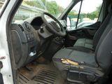 the interior of a van with the door open and the driver ' s seat down