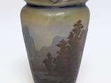 a vase that is sitting on a white surface