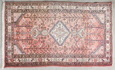 an old persian rug with a diamond design on it