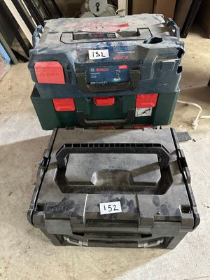 two tool boxes sitting next to each other on the floor