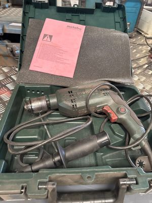 a box with tools in it sitting on a table
