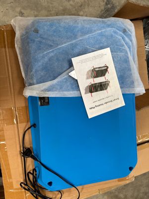 a blue box with a blue sheet on it and a blue sheet on top of it