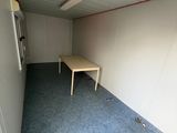 a room with a table and a window in it
