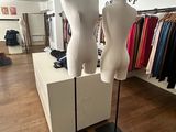 two mannequins on display in a clothing store