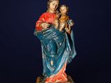 an image of a statue of a woman holding a child