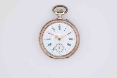a gold pocket watch with roman numerals on the face
