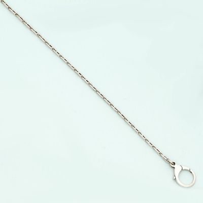 a close up of a chain on a white surface