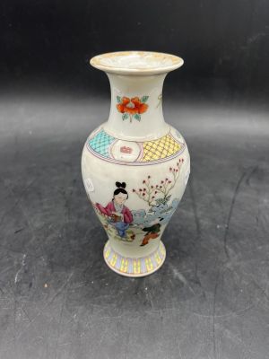 a small vase that is sitting on a table