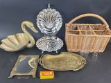 a basket, tray, mirror, and other items that are on a table