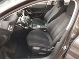the interior of a car with black leather seats and a steering wheel