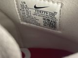 the shoe is white and has a red stripe on the side
