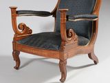 an image of a wooden chair with a black upholstered seat