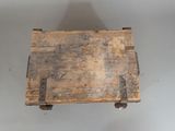 a small wooden box with a handle on a table
