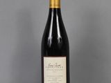 a bottle of wine that is sitting on a table