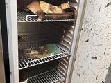 a refrigerator that has some food inside of it