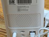 a white air purifier sitting on a wooden table
