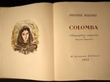 an open book with a picture of a woman on it