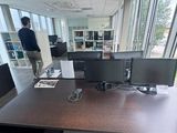 an image of a man standing in an office setting