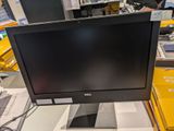 a computer monitor sitting on a table in a store