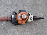 a close up of a hedger on the ground with a chain attached to it