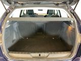 a trunk of a car with the back door open