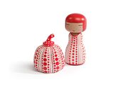 une paire de figurines rouges et blanches ornées de pois