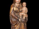 an image of a statue of a woman holding a baby