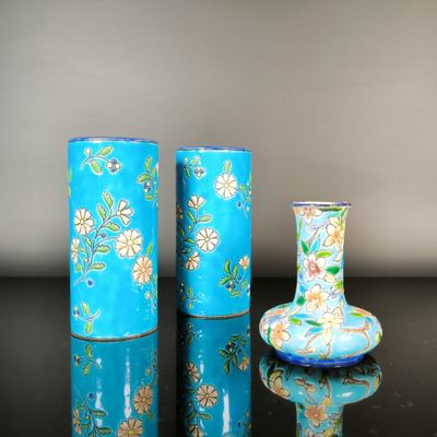 three vases sitting next to each other on a table