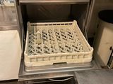 an image of a dishwasher with dirty dishes in it