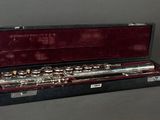 a flute that is in a case on a table