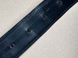 a close up of a black leather belt on a white surface
