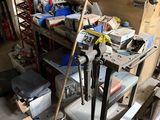 a garage with a lot of tools on the shelves