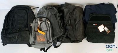 several pieces of luggage are lined up on a white surface