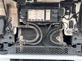 a close up view of a car ' s radiator and air conditioning system