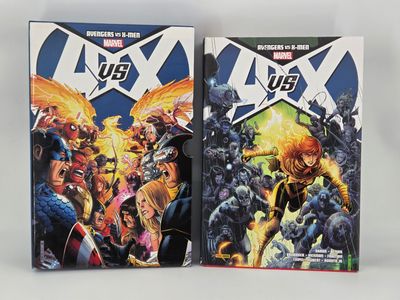 two covers of the new x - men comic books are on display