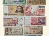 a lot of different bank notes on a white background
