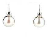 pearl and diamond earrings on a white background
