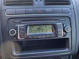 a radio in the center of a car with a clock on it