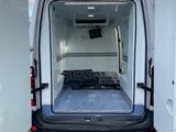 the back of a white van with its doors open