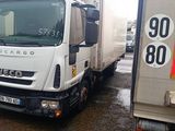 two trucks parked next to each other in a parking lot