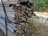 a pile of wood sitting on the side of the road