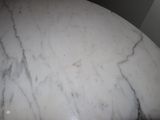 a marble table top with a white marble table top