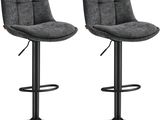 une paire de tabourets de bar gris avec des pieds en métal noir