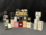 many different types of perfume bottles and boxes on the table