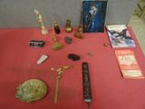a red table with a red table cloth and a red table cloth with various items on it