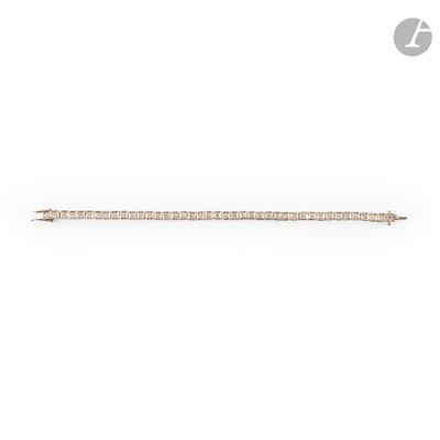 an image of a gold and diamond bar brooch