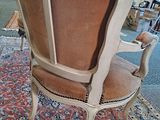 a chair that is sitting on a rug in a room